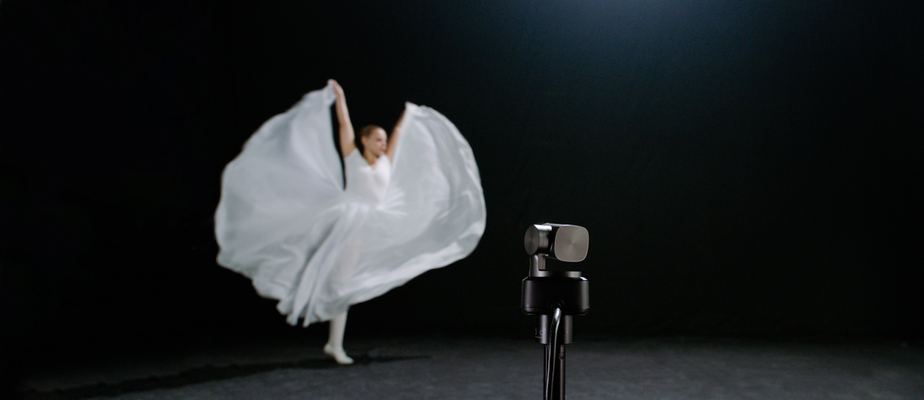 a ballerina dancing in front of an obsbot tiny 2 webcam which is tracking her movements